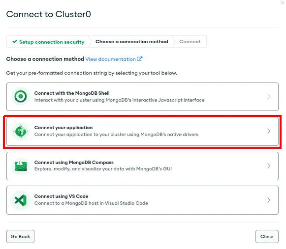 Janela Connect to Cluster0 com a opção Connect your application destacada